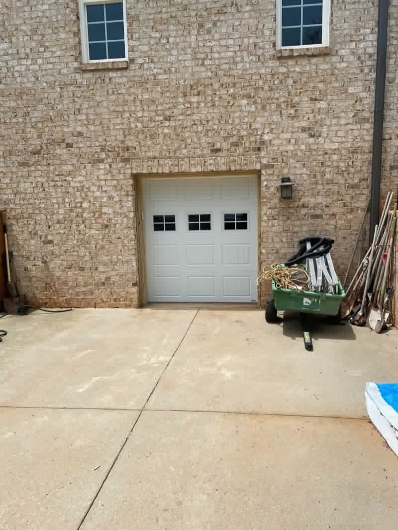 White carriage-style garage door with windows