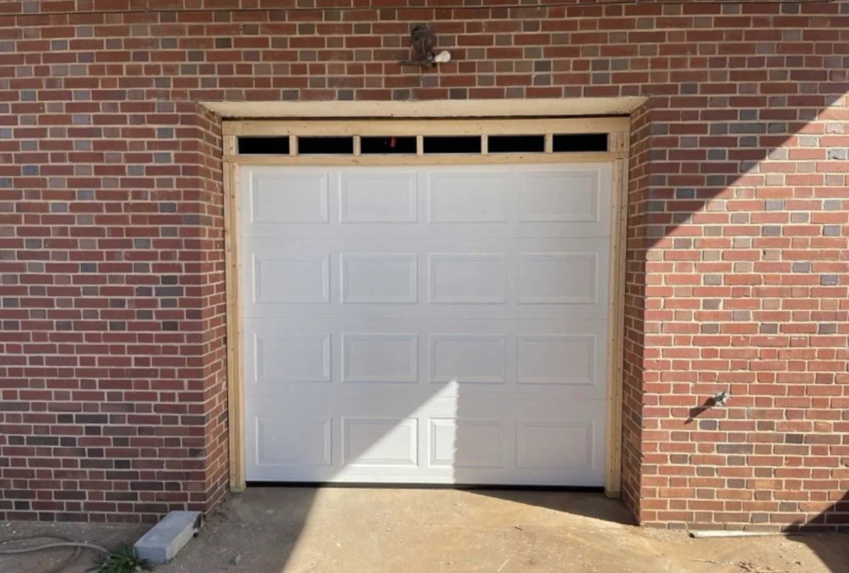 A garage door getting its yearly once-over